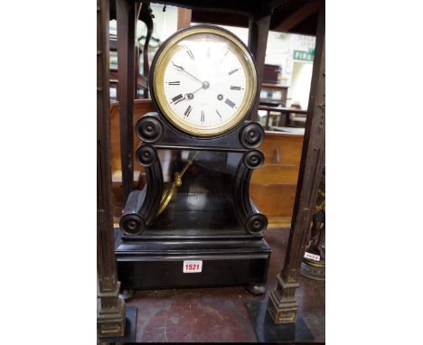 An ebonized mantel clock,&nbsp;with enamel dial inscribed 'Rollin, a Paris', 44.5cm high, with pendulum.&nbsp; 