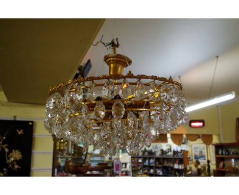 A vintage gilt brass and faceted glass multi-branch ceiling light,&nbsp;51cm diameter. 