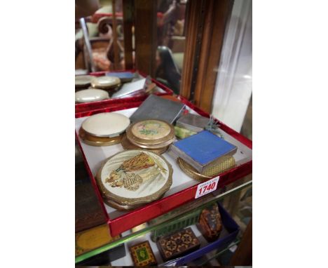 Twelve vintage compacts.&nbsp; 