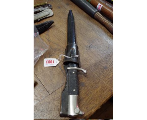 A German World War II Wehrmacht parade bayonet and scabbard,&nbsp;the blade inscribed 'Original Eickhorn, Solingen', engraved