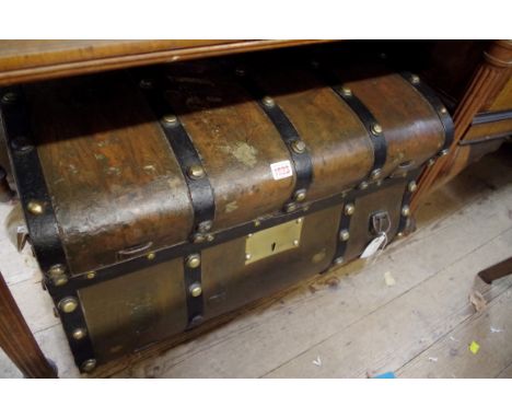 A mid 19th century American stagecoach trunk, of bombe form, 71cm wide. 