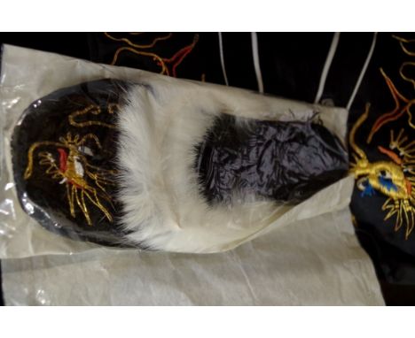 A vintage Chinese embroidered black silk pyjama set,&nbsp;comprising: jacket, trousers, gown, and slippers, in original box.&
