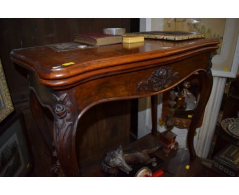 A Victorian figured walnut serpentine card table, 83cm wide.