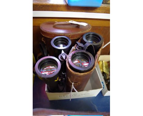 Two pairs of British Navy 7X binoculars,&nbsp;each by 'Barr &amp; Stroud', with broad arrow markings, each in leather case. 