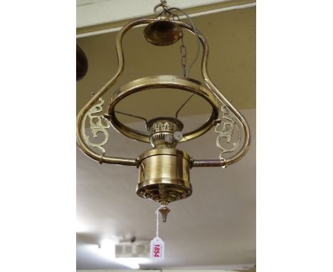 A brass hanging oil lamp,&nbsp;converted, (lacking shade). 