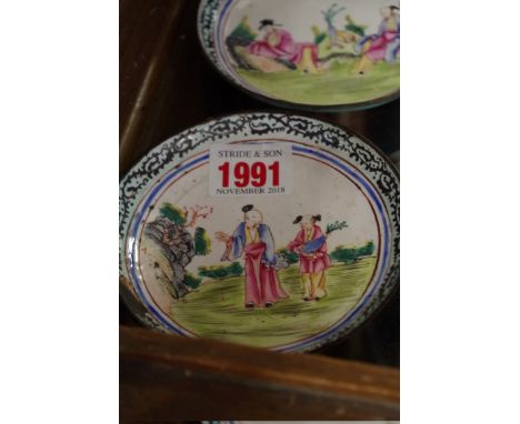 A pair of Chinese Canton enamel dishes, probably Kangxi, 10.6cm diameter, (s.d. to one). 
