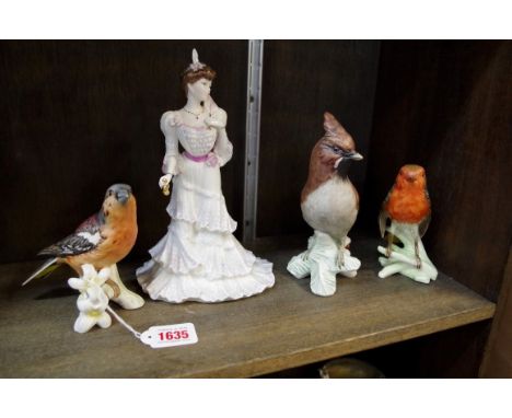A Coalport figure of Eugenie;&nbsp;together with three Goebel birds.&nbsp; 