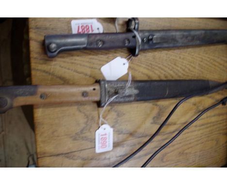 A German 1884/98 pattern knife bayonet and steel mounted leather scabbard, by 'C G Haenel of Suhl', 25cm blade.&nbsp; 