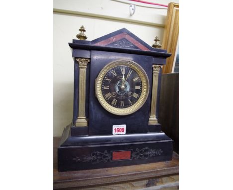 A late 19th century slate, brass and marble mantel clock,&nbsp;31cm high.&nbsp; 