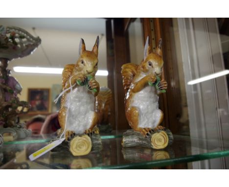 Two rare Victorian Royal Worcester porcelain squirrels,&nbsp;Model No.220, impressed mark, 15cm high, (chips).&nbsp; 