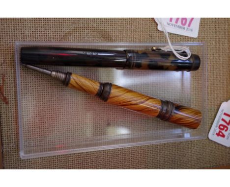 Pens: a vintage fountain pen with 14ct nib; together with another segmented travelling type pencil. 