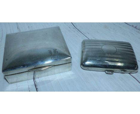 A silver cushion shaped cigarette case, Birmingham 1922, 2.3 oz.; a silver cased cigarette box with cedar lining