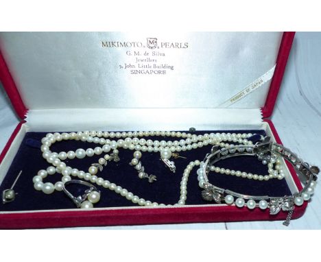 A Mikimoto box containing cultured pearl jewellery including ring and bracelet with leaf mounts (bracelett stamped 'M' silver