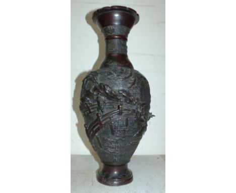 A large oriental bronze vase decorated in high relief with figure of a warrior on a bridge, script and seal mark, 18½"