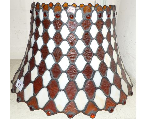 A Tiffany style table lamp with leaded coloured glass shade