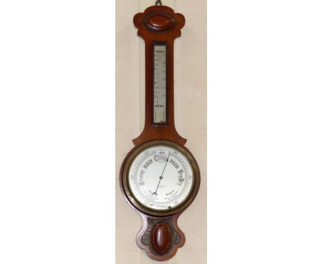 An Edwardian mahogany banjo aneroid barometer with thermometer