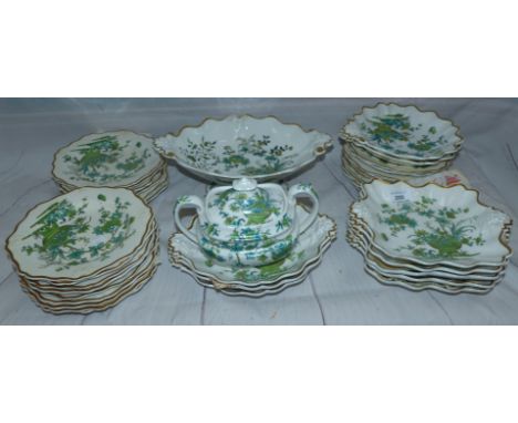 An early 19th century Ridgway dessert service, hand painted in green with flowers in the Chinese manner, comprising comport, 