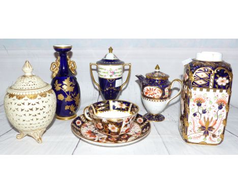 A small Wedgwood covered jug decorated in gilt and blue; a small porcelain blue and gilt vase; a Royal Crown Derby cup and sa