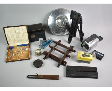 A Collection of Sundries to include Velbon CX Mini Camera Tripod, Volkswagen Hub Cap, Samsung Camcorder, Boxed Poker Dice Gam