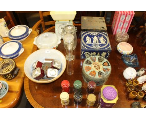 A collection of storage tins, kitchen scales, mixing bowl etc.