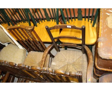 A rush seated and ladder back elbow chair; and one other rush seated chair 