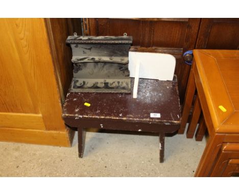 A painted wooden stool; a wall shelf; and a pipe rack 