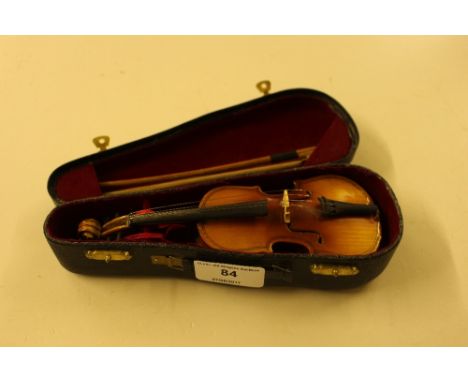 A miniature violin and bow in fitted case