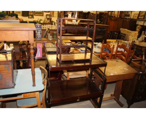 A folding two tier tea trolley; and a book shelf