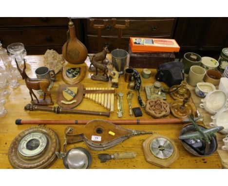 A collection of various wooden items to include barometer, a pair of olive wood travelling candlesticks, various wall plaques