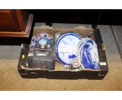 A box containing silver plated chamber stick; various other metalware; blue and white china; Imari patterned plates etc. 