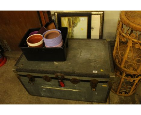 A traveling trunk and a box of plant pots and jardinières 