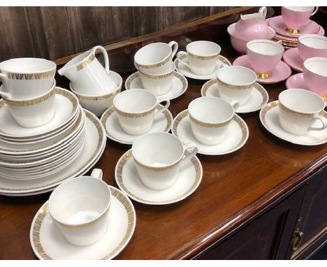 ROYAL TUSCAN ISIS TEA SERVICE, comprising 11 trios, 2 sandwich plates, cream and sugar, along with a Tuscan pink and gilt dec