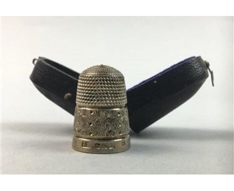 SILVER THIMBLE, in casealso two child's silver bangles, a plated bangle and a 'coach' charm (5)