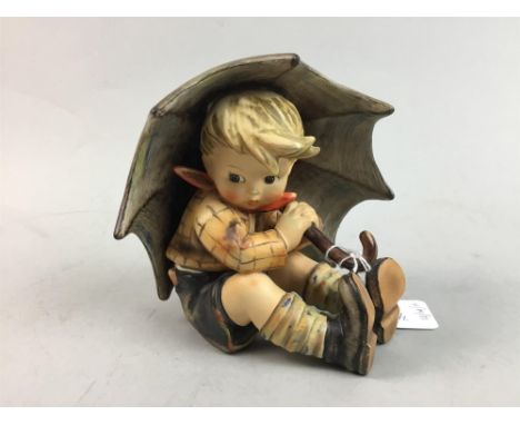 GOEBEL FIGURE OF A SEATED BOY, modelled holding an umbrella, 13cm high, along with a Lladro figure of a girl modelled holding