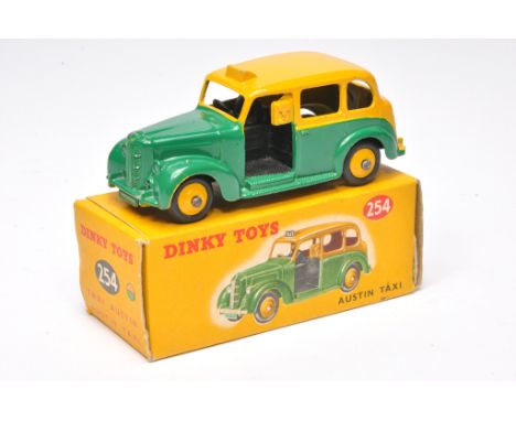 Dinky no. 254 Austin Taxi. Yellow / green. Displays very good with the odd mark of wear. In good box.