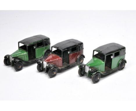 Dinky trio of no. 36 Taxi. Duo in green, one in maroon. Display good to very good.