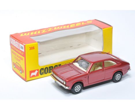 Corgi No. 306 Whizzwheels Morris Marina 1.8 Coupe. Burgundy red with off-white interior. Displays excellent, with little sign