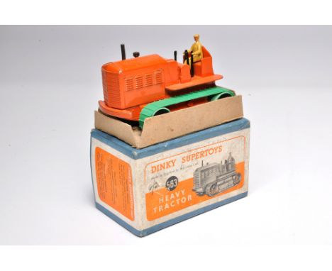 Dinky No. 563 Heavy Tractor. Displays good to very good, albeit does have replacement tracks. In fair to good box.