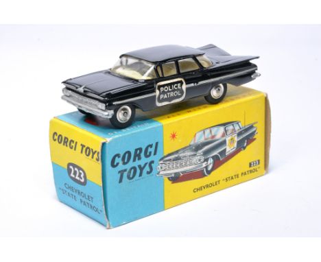 Corgi No. 223 Chevrolet State Patrol Car. Black, lemon interior, chrome hubs. Displays good, very minor wear to paint, but is