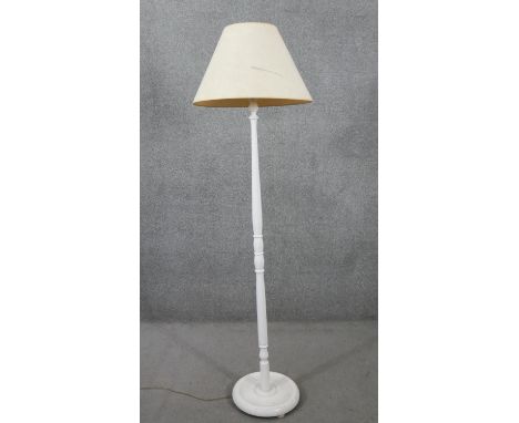 A painted carved standard lamp with cream shade. H.180 Diam.36cm 