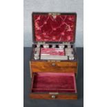 A 19th century rosewood and brass bound vanity travel box with silver lidded boxes and bottles,