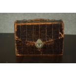 An alligator leather case of Masonic items, including regalia and medals. H.17 W.24 D.10cm.