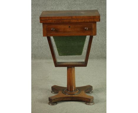 A Victorian rosewood games and sewing table, the rectangular fold out top with inlaid chess and backgammon boards inside, ove