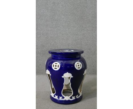 A blue and white glaze pierced design Chinese ceramic garden stool.  aH.46 Diam.39cm 