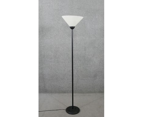 A black metal standard lamp with frosted glass conical shade. H.169 Diam.36cm 