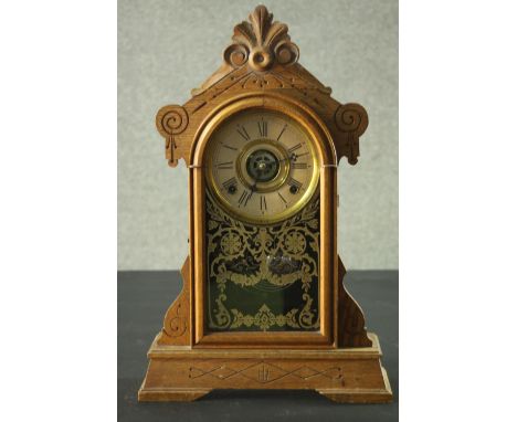 A late 19th century American Ansonia type oak cased mantel clock with eight day movement. H.52 W.28 D.12cm. 