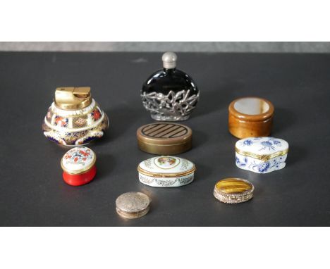 A collection of various trinket boxes, a Royal Crown Derby Imari design table lighter and blue glass perfume bottle. The boxe