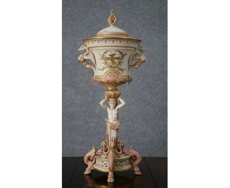 An early 19th century&nbsp;Royal Worcester hand painted porcelain lidded urn, the top painted with gilded birds, mystical win