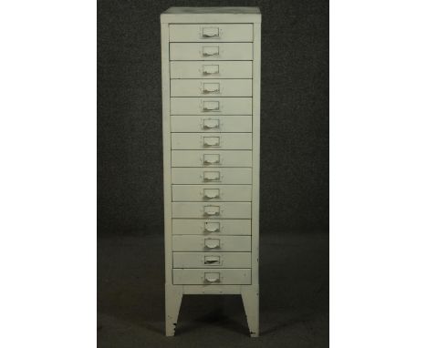 A 20th century white painted steel filing cabinet, with fifteen drawers, on tapering backet legs. H.100 W.29 D.39cm. 