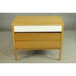 A mid 20th century oak chest of three long drawers, probably E Gomme, G-Plan, the top drawer